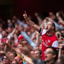 Arsenal fans cheering at the match